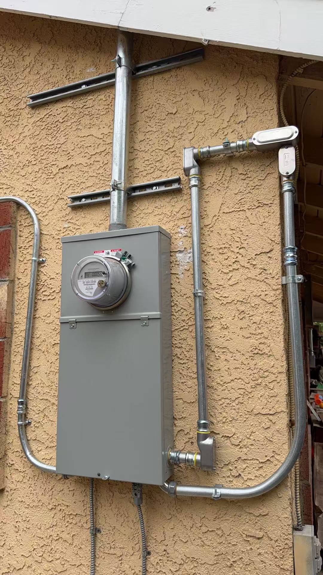 Meter panel & conduit installation — Ampower Construction Group project photograph